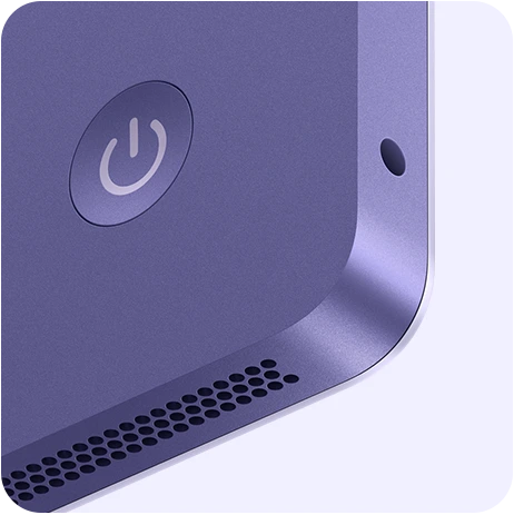 Close-up of the purple iMac with power button and speaker grille