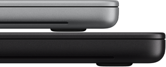 14-inch MacBook Pro with PROLED XDR Display, silver color, stacked on top of 16-inch model, space black color, showing size difference