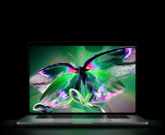 MacBook Pro with PROLED XDR Display, open lid, silver color, display shows detailed, high-contrast image with vivid colors, screen illuminates keyboard